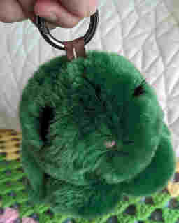 Me holding the fuzzy bunny by its keychain